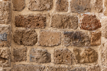 Detail of a section of an old stone wall of the fortress in Acre, Israel