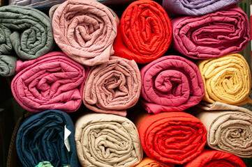 Rolls of soft, colorful blankets