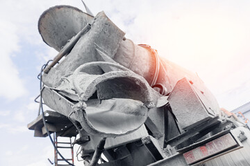 Closeup truck mixer concrete pump working on construction building site, sunlight © Parilov