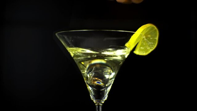 Refreshing aperitive drink . Dry Martini cocktails with ice cube