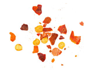 Close up spicy chili red pepper flakes, chopped, milled dry paprika pile isolated on white 