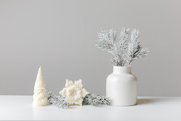 Christmas and New Year composition. Christmas fir tree branches, gifts, pine cones on wooden white...