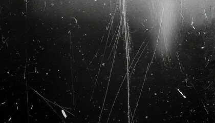 white dust and scratches on a black background the texture of dirt on the glass - obrazy, fototapety, plakaty