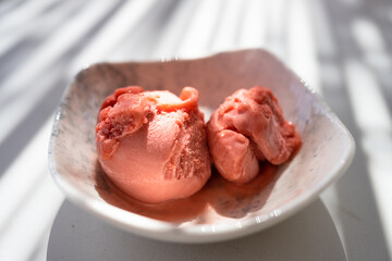 Rose ice cream in a marble pot. Greece. - 696060527