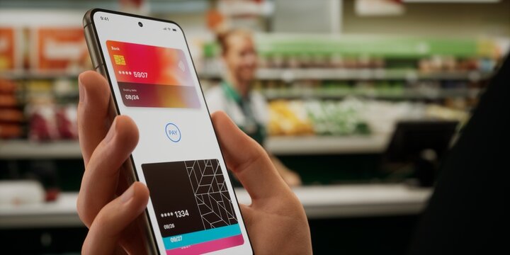 Caucasian male using his smartphone wallet to pay using card connected to phone