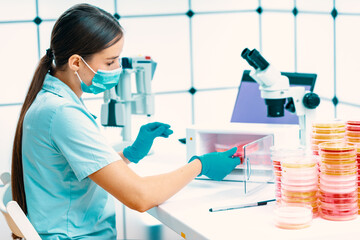  Female scientist conducting a medical research experiment in a laboratory