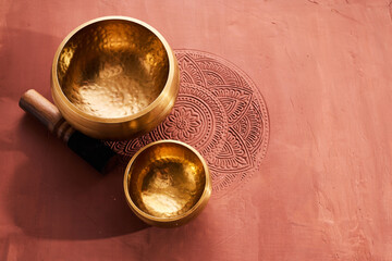 A close up of a tibetan singing bowl or himalayan bowl for therapy, meditation and relaxation. - obrazy, fototapety, plakaty