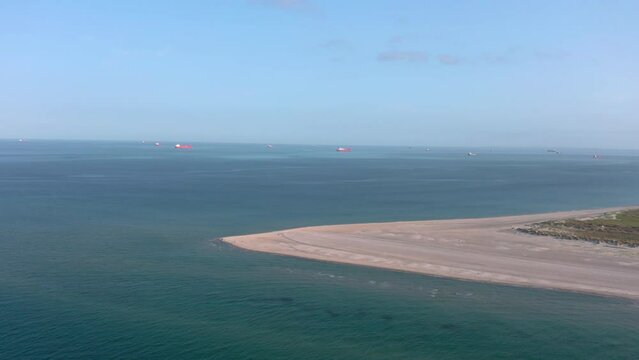 Aerial landscape panorama of Skagen Odde peninsula and Grenen - a meeting point of North and Baltic Sea (Skagerrak and Kattegat). North Jutland, Nordjylland, Denmark