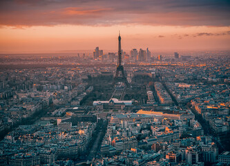 Paris, France: Aerial view over the city with Eiffel tower and La Defense modern architecture...