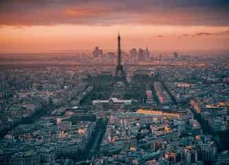 Photo sur Plexiglas Paris Paris, France: Aerial view over the city with Eiffel tower and La Defense modern architecture behind it