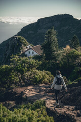 Solitary Hiker Approaching Mountain Refuge in Madeira