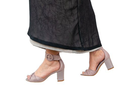 Well groomed ladies feet in high heeled sandals. Close up of lower legs and feet. The woman wears a long skirt made of two layers. Isolated in front of a transparent background. - Powered by Adobe