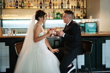 bride and groom inside a cocktail bar