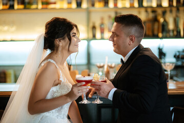 bride and groom inside a cocktail bar