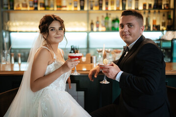 bride and groom inside a cocktail bar