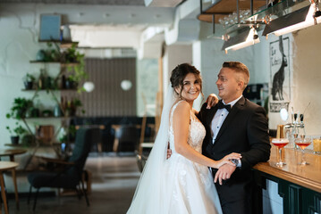 Fototapeta premium bride and groom inside a cocktail bar
