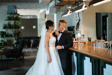 bride and groom inside a cocktail bar