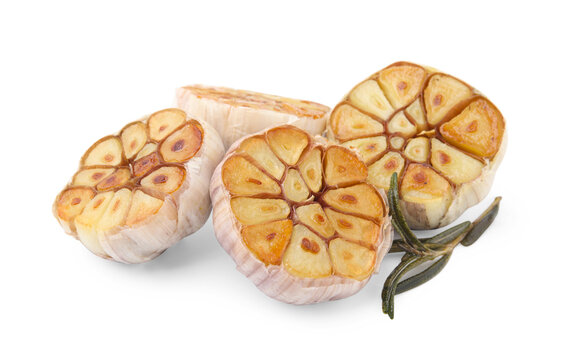Heads of fried garlic and rosemary isolated on white