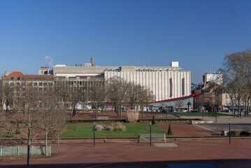 Metz, France - January 19th 2019 : View of the Esplanade de Metz, a large public garden in the heart of the city with modern buildings in the background.