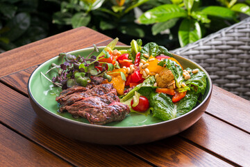 grilled beef steak with vegetables on plate