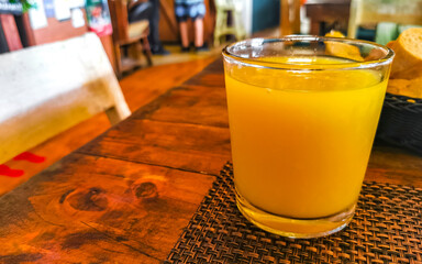 Orange fruit juice in restaurant PapaCharly Playa del Carmen Mexico.
