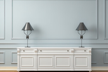 An elegant living room featuring a white cabinet with two symmetrical wall lamps on a textured gray wall, conveying a chic and balanced look.