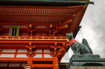 fox statue at the main gate of fushimi inari shrine . the most famous attraction of Kyoto, Japan....