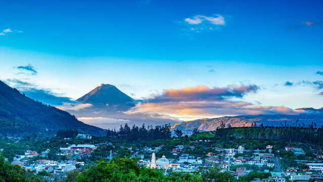 Patate town and Tungurahua volcano during sunrise in Andes of Ecuacor