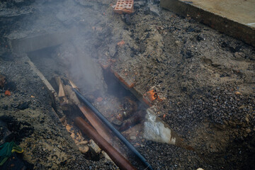 Leak of water in broken old rusty pipes of the heating system