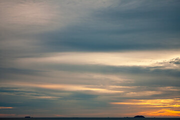 Amazing natural fenmen on the romantic colorful sunset sky with illuminated contrast warm clouds on the horizon surrounded by cinematic atmosphere 