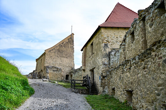 Famous castle ruins of Rupea Citadel, Cetatea Rupea, ruins of a castle in summer with a blue sky, Rupea, Transylvania, Romania	
