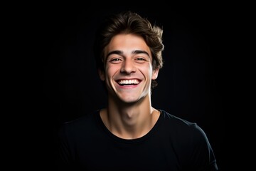 Portrait of a Young Man Smiling Isolated on a Black Background. Generative AI.