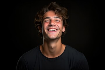 Hearty Laugh of a Young Man with Curly Hair on Dark Background. Generative AI.
