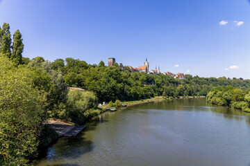 Fototapeta na wymiar Bad Wimpfen with a view of the old church and the historic city wall over the Neckar river