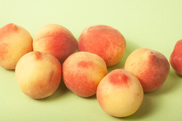 Fototapeta na wymiar peaches on green background