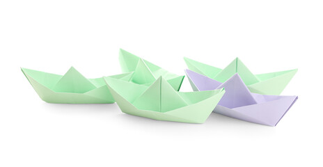 Colorful origami boats on white background