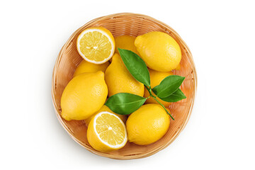 Ripe lemons in wicker basket isolated on white background. Top view. Flat lay.