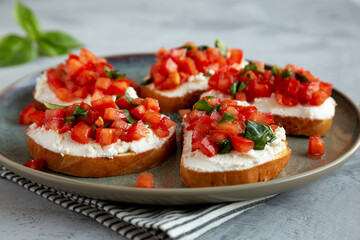 Homemade Tomato Ricotta Tartine on a Plate, low angle view. Close-up.