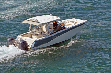 sport fishing boat powered by two outboard engines - obrazy, fototapety, plakaty