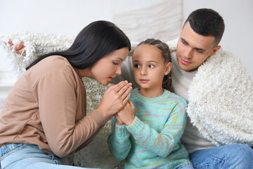 Frozen family with lack of heating warming hands at home