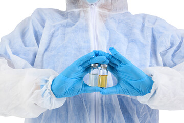 Medical worker in protective suit and with ampules on white background, closeup. Vaccination concept
