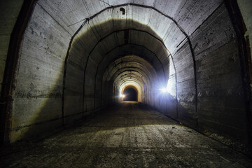 Dark tunnel at old underground bunker
