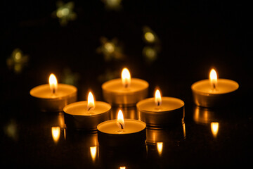 Candles shining in the darkness