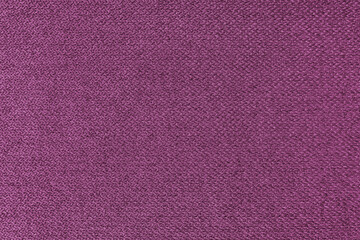 Fototapeta premium Textile background, pink coarse fabric texture, jacquard woven upholstery, furniture textile material, wallpaper, backdrop. Cloth structure close up.