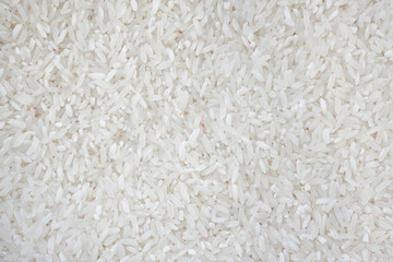 Top view of white rice seed texture background. Organic, natural long rice grain, food for healthy....
