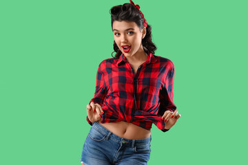 Attractive pin-up woman on green background