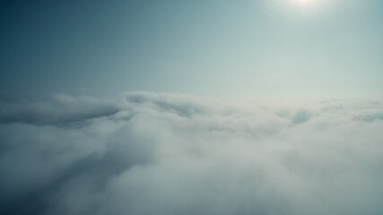 Naklejka na ściany i meble Clouds over the mountains