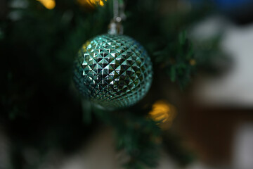 Happy 2024 concept, Christmas ball and lights on Christmas tree.
