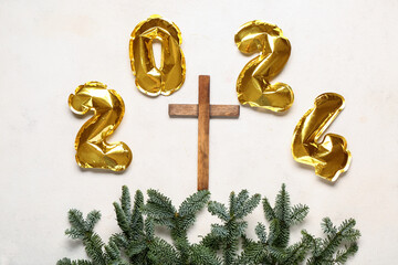 Cross with fir branches and figure 2024 on white grunge background. Concept of Christmas story