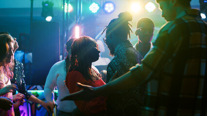 Happy couple dancing on slow music, enjoying romantic moment on dance floor. Dance partners having...